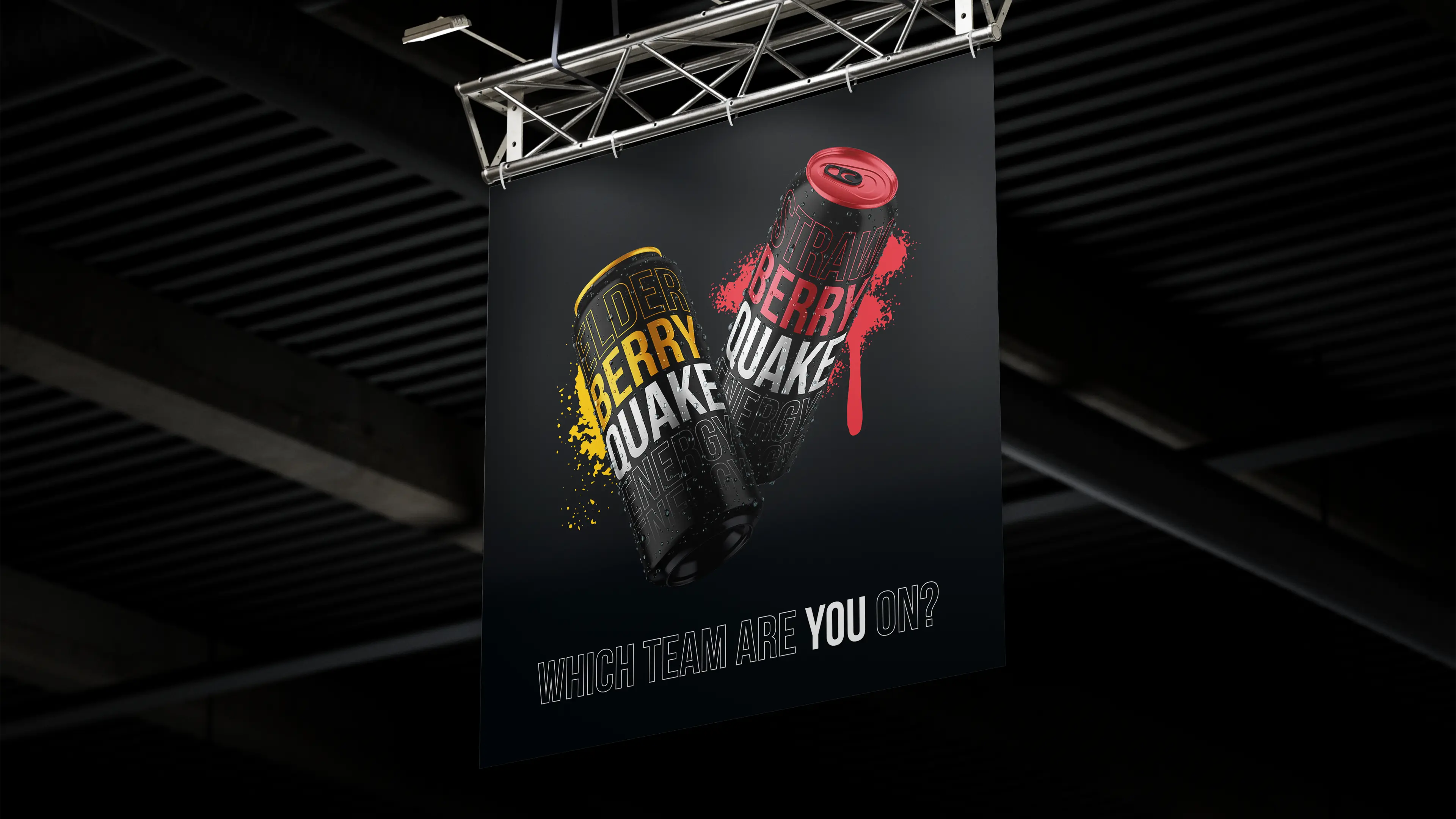 Banner mockup: hanging banner in a dark industrial space, showing two floating energy drink cans: an Elderberry, and a Strawberry Quake can. The tagline below reads 'Which team are you on?'